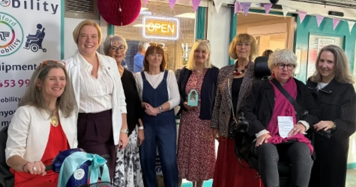 Campaigners, volunteers and council representatives at the reopening of Guildford Shopmobility in Bedford Road car park.